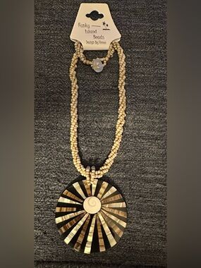 FUNKY ISLAND BEADS Shell & Bead Pendant Necklace in Cream, Brown & Black.